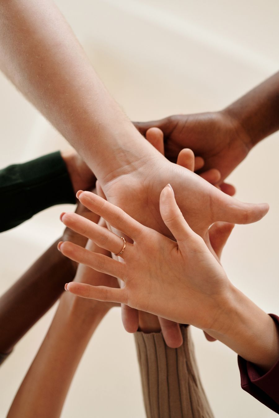 Diverse hands coming together